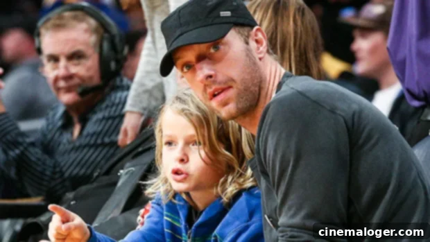 Chris Martin Beams With His Mini Me Kids Apple (14) And Moses (12) Amid Gwyneth Paltrow's $3.1 Million Lawsuit 1 featured 3495556