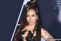 Tiny’s Teeny Black Plunge: Bigger On Sex Appeal