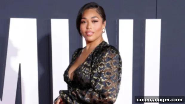 Jordyn Woods Flaunts Her Curves in Skintight Brown Dress 1 featured 3804237