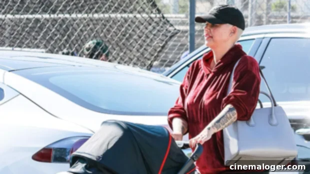 Amber Rose Debuts Forehead Tattoo While Kissing 5-Month-Old Slash in Sweet Video 1 featured 3960253