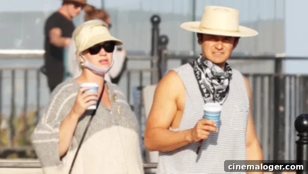 Beachside Bliss: Katy Perry's Baby Bump Joins Orlando Bloom for Romantic Stroll 1 featured 4125943