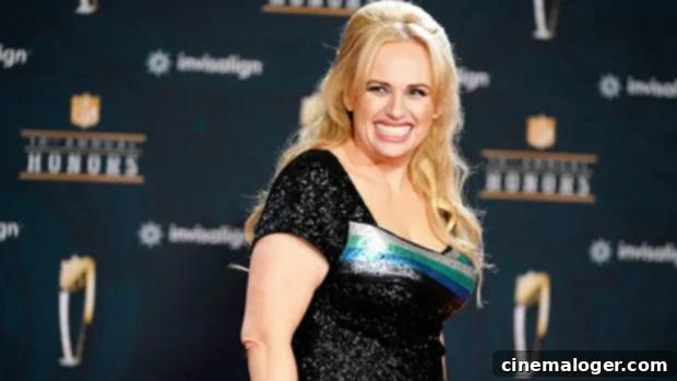 Rebel Wilson Stuns Emerging From The Water In A Low-Cut Black Swimsuit 1 featured 4519672