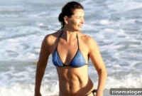 Paulina Porizkova, 56, Radiates In A Skimpy White Bikini While Lost In Thought On Her Getaway