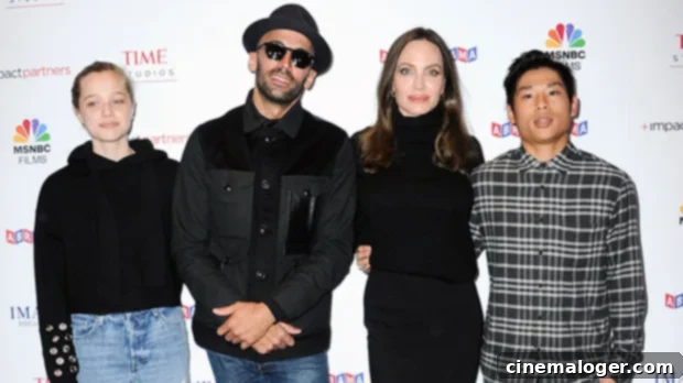 Shiloh Jolie-Pitt, 15, Stuns in Ripped Denim, Mirrors Angelina's Chic Presence at Premiere with Family 1 featured 4585153