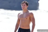 Joseph Baena Embodies Arnold Schwarzenegger With Shirtless Beach Pose