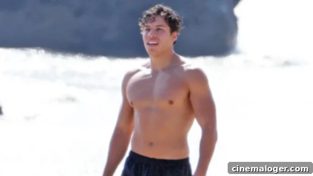 Joseph Baena Embodies Arnold Schwarzenegger With Shirtless Beach Pose 1 featured 4632174