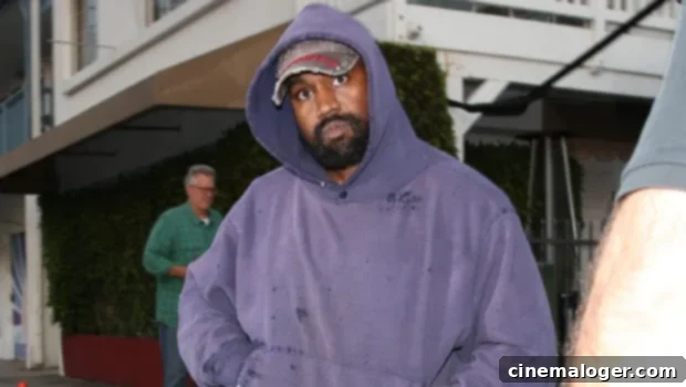 Kanye West Rocks Distressed Purple Hoodie For Santa Monica Dinner 1 featured 4828385