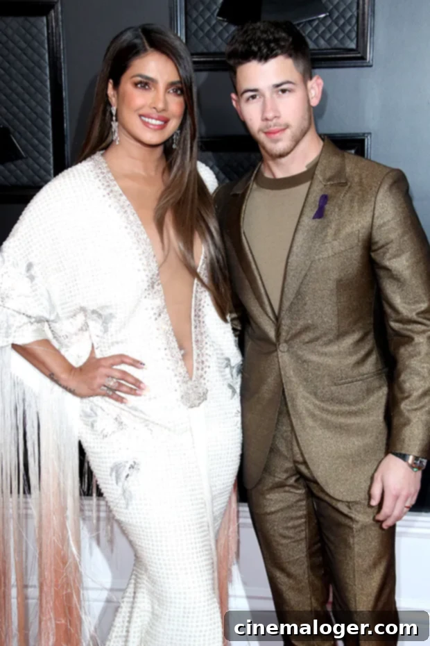 Priyanka Chopra and Nick Jonas Become Parents Through Surrogacy 3 Priyanka Chopra and Nick Jonas pose elegantly on the red carpet, showcasing their iconic style as a couple.