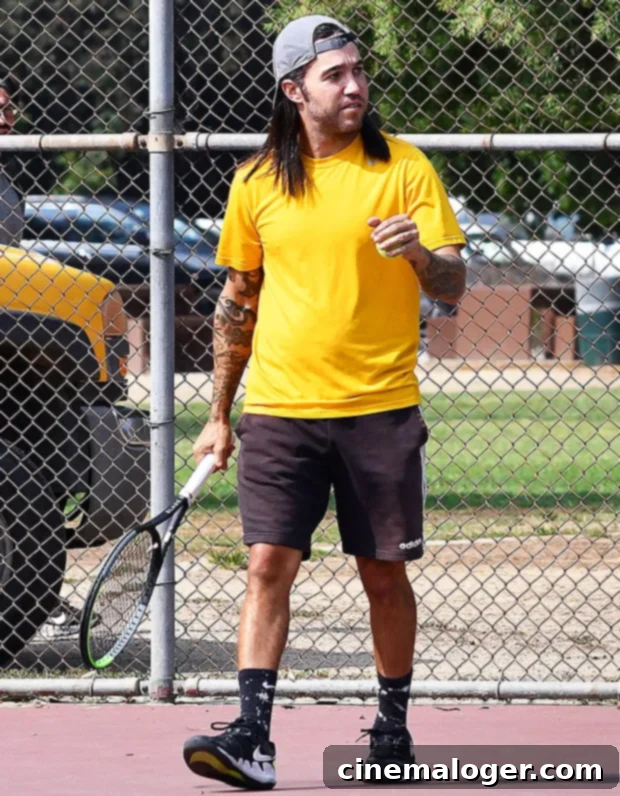 13 Celebs' Most Jaw-Dropping Ice Blonde Hair Moments 3 Pete Wentz playing tennis with dark hair