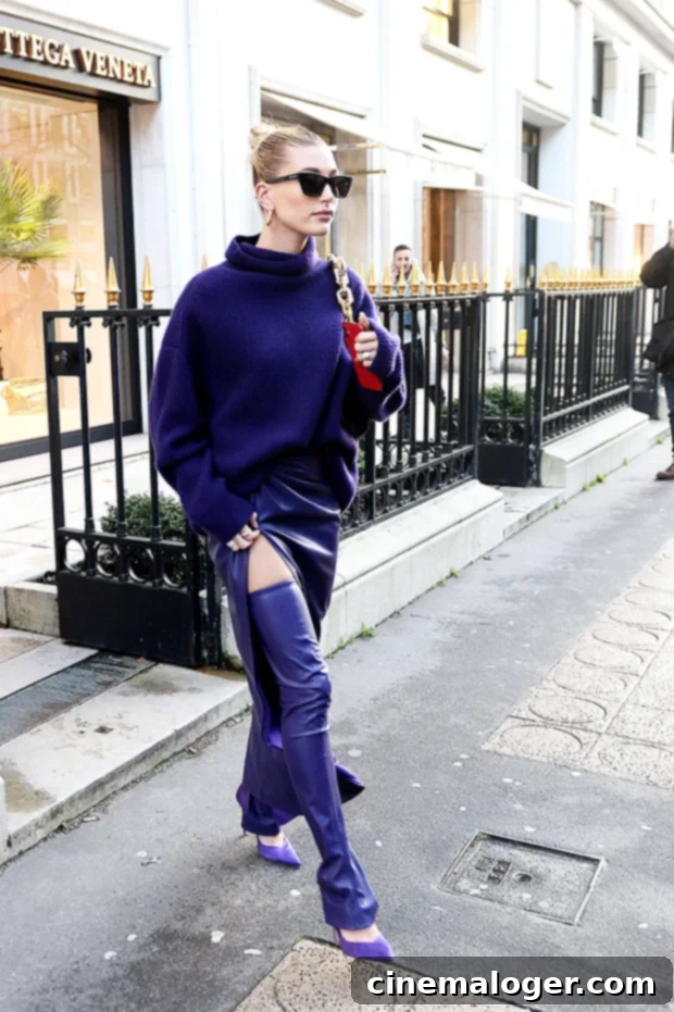 Hailey Baldwin in a plum monochromatic outfit with purple heels during Paris Fashion Week.