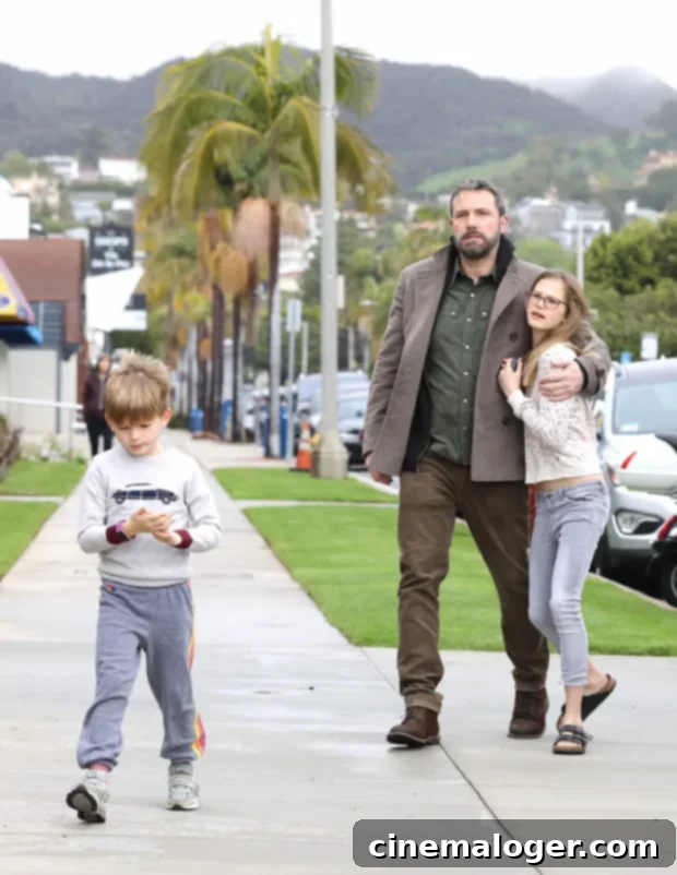 Pacific Palisades, CA - Jennifer Garner and Ben Affleck don't let the rain stop them as they arrive for Sunday church services. The pair, who are committed to coparenting their kids, arrived in separate cars, with the kids riding with Ben in the Range Rover, and Jen arriving with wet hair in the Lexus sedan. Ben looks like he's stepping up and taking parenting duties seriously, as he and eldest daughter Violet shared a sweet bonding moment as they entered the church together.Pictured: Ben Affleck, Violet Affleck, Samuel Affleck BACKGRID USA 3 FEBRUARY 2019 BYLINE MUST READ: Lastarpix / BACKGRID USA: +1 310 798 9111 / usasales@backgrid.com UK: +44 208 344 2007 / uksales@backgrid.com *UK Clients - Pictures Containing Children Please Pixelate Face Prior To Publication*
