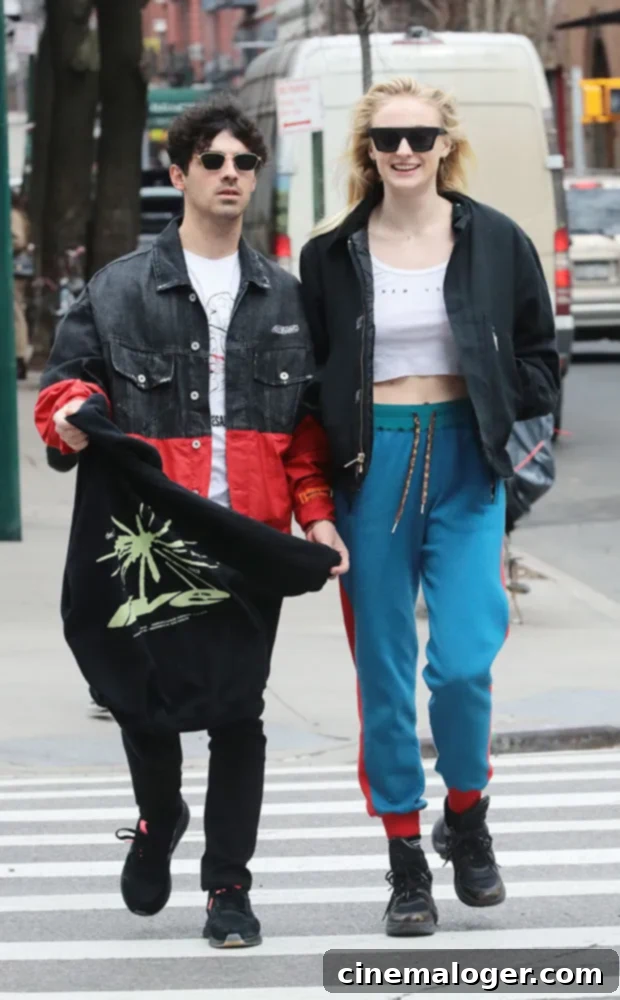 Sophie Turner's Breezy Crop Top Chic on NYC Streets with Joe Jonas 3 Sophie Turner and Joe Jonas walking together, with Joe wearing Adidas kicks.