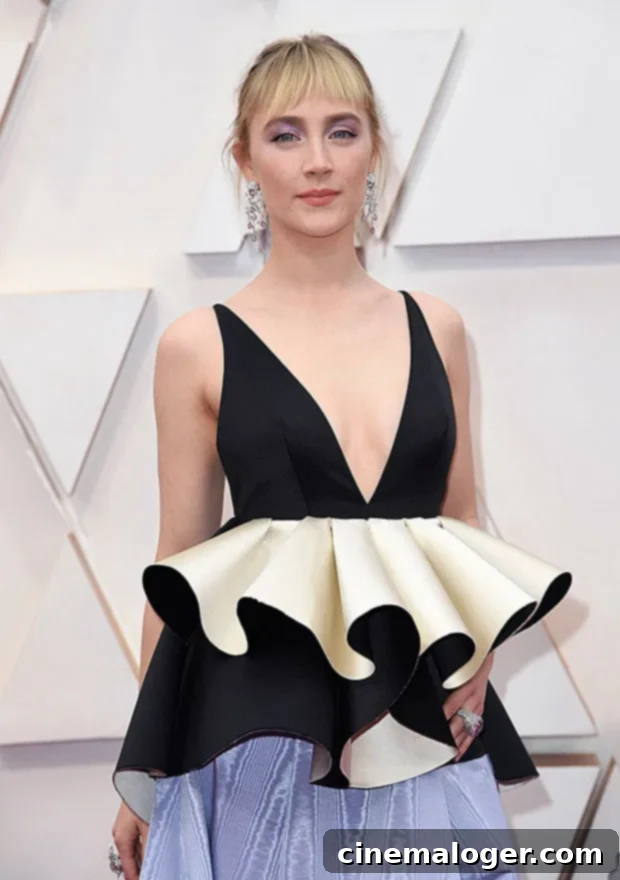 St. Patrick's Day: Jamie Dornan, Niall Horan and More Hot Irish Stars 4 Saoirse Ronan posing elegantly at an awards ceremony