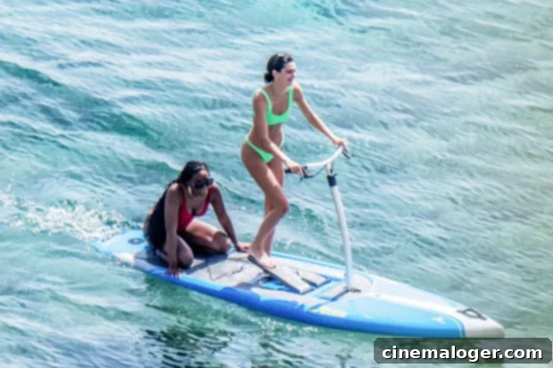 Kendall Jenner's Mykonos Bikini Bash Neon Green Abs and Island Glamour 2 Kendall Jenner flaunts a neon green bikini while paddleboarding in Mykonos, showcasing her incredible physique.
