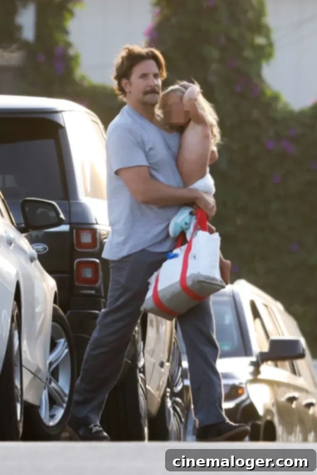 Bradley Cooper's Adorable Beach Day With Daughter Lea 2 Bradley Cooper carrying daughter Lea after a fun beach day in Malibu