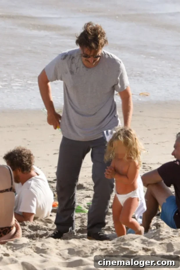 Bradley Cooper's Adorable Beach Day With Daughter Lea 3 Bradley Cooper and daughter Lea playing on Malibu beach, building sandcastles