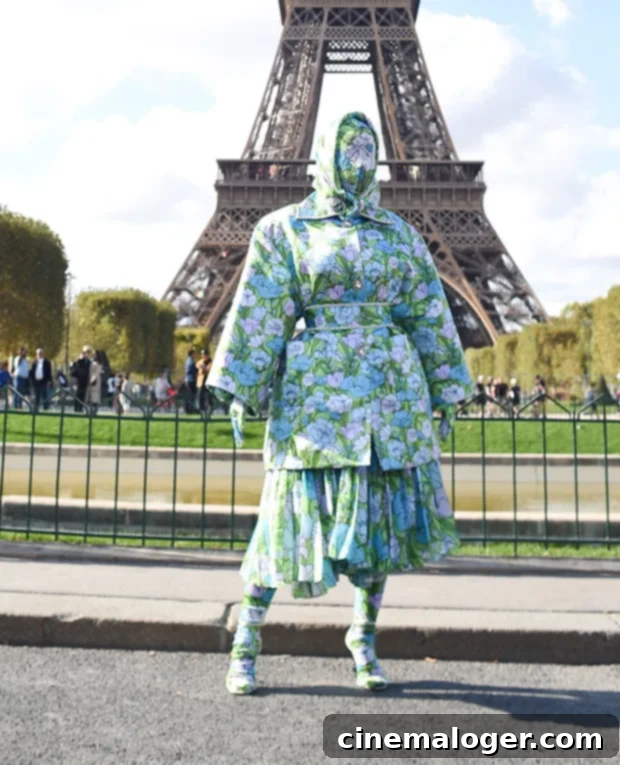 Cardi B's Paris Florals: A Breathless Fashion Statement 2 Cardi B in a dramatic head-to-toe floral outfit posing in front of the Eiffel Tower during Paris Fashion Week.