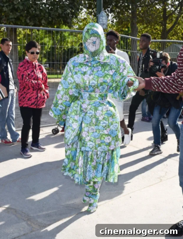 Cardi B's Paris Florals: A Breathless Fashion Statement 3 Cardi B turning heads on the streets of Paris in her vibrant head-to-toe floral ensemble, showcasing her fearless approach to high fashion.