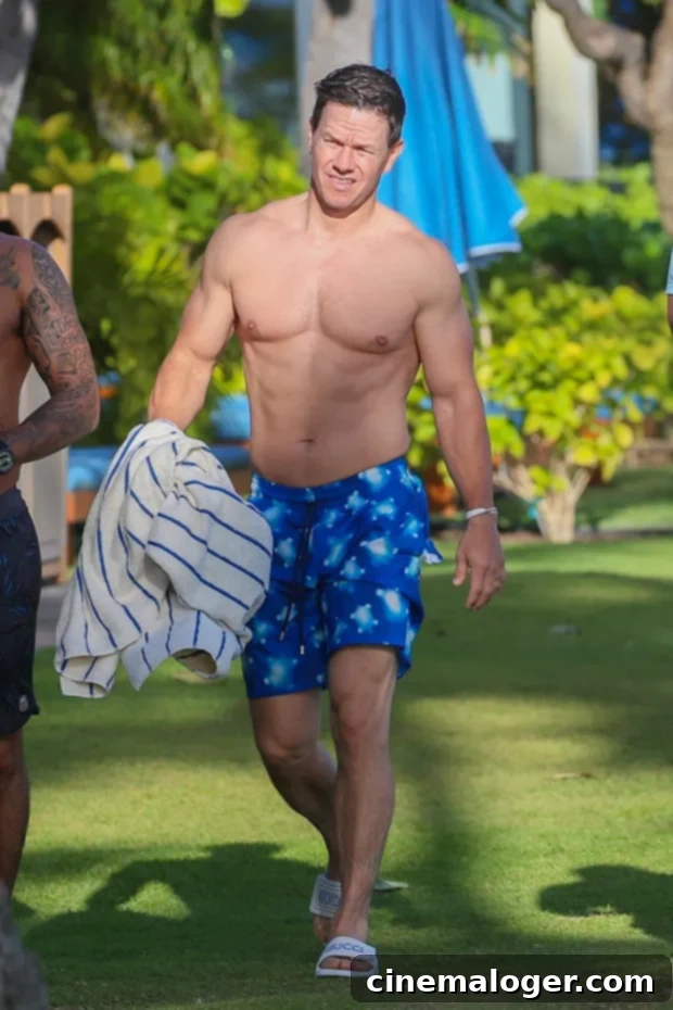 Mark Wahlberg, 48, Displays Shredded Beach Body In Hawaii 2 Mark Wahlberg shirtless in Hawaii, showcasing his incredible physique.
