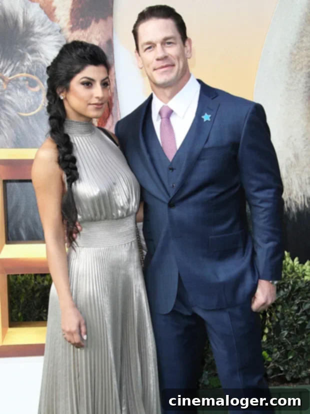 John Cena's wife giggling as he spoke about her on the 'Ellen' show.