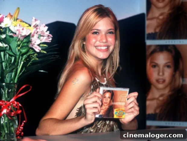 Mandy Moore smiling and posing, reflecting on her career