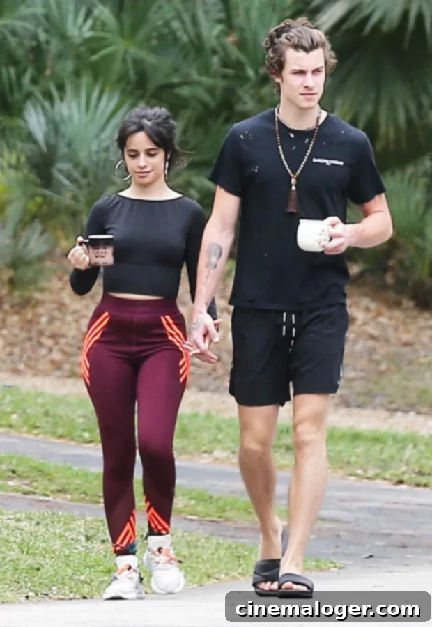 Doctors Agree: Walking Is Your Easiest Path to Mental Well-being 2 Miami, FL - *EXCLUSIVE* - Quarantine couple Camila Cabello and Shawn Mendes got a dose of Vitamin D with their caffeine in Miami this morning during a walk around their neighborhood. The adorable couple walked hand in hand chatting together as they stepped out for a bit of healthy exercise. Camila who recently announced that she would be postponing her tour dressed up her leggings and crop top with a large pair of hoops while Shawn sported black shorts, a ripped t-shirt, slides and a set of Buddhist prayer beads around his neck.Pictured: Camila Cabello, Shawn Mendes BACKGRID USA 26 MARCH 2020 BYLINE MUST READ: MiamiPIXX / BACKGRID USA: +1 310 798 9111 / usasales@backgrid.com UK: +44 208 344 2007 / uksales@backgrid.com *UK Clients - Pictures Containing Children Please Pixelate Face Prior To Publication*