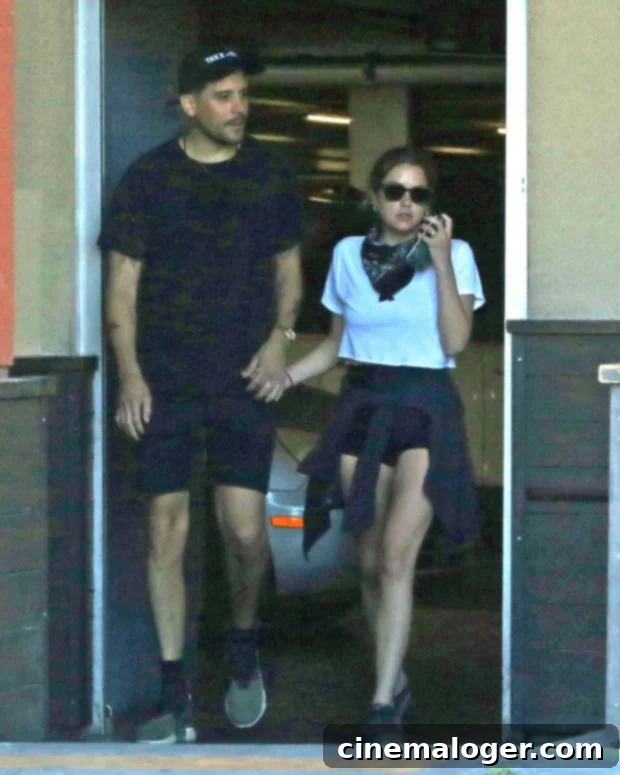 Ashley Benson and G-Eazy attending a wedding, looking stylish and happy together.