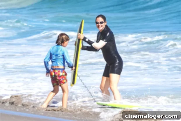 Christian Bale, Jennifer Garner & Celebs Bond With Kids Body-Boarding At The Beach 4 Jennifer Garner bodyboarding with her son Samuel in Malibu