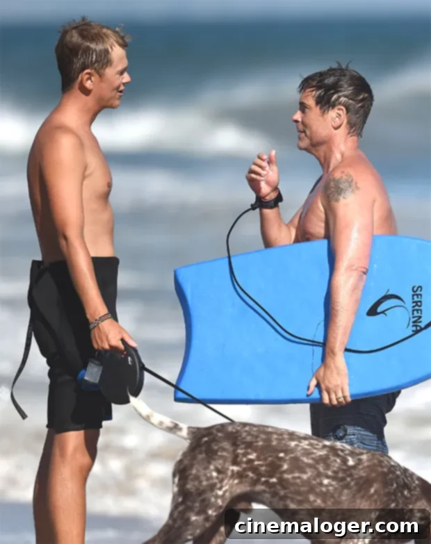 Christian Bale, Jennifer Garner & Celebs Bond With Kids Body-Boarding At The Beach 5 Rob Lowe on Santa Barbara beach with his son Matthew