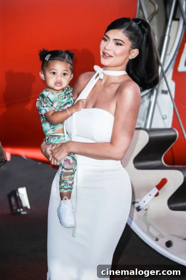 Stormi's Name on Kylie Jenner's $320k Rolls: A Look at Celebs' Six-Figure Cars 3 Kylie Jenner posing next to a luxury car.