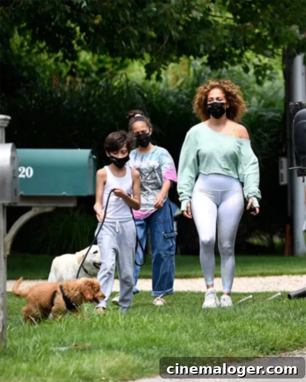 Jennifer Lopez Rocks Natural Curls on Morning Walk With Her 12-Year-Old Twins Max and Emme 3 Jennifer Lopez with her twins Max and Emme during a morning walk in The Hamptons.