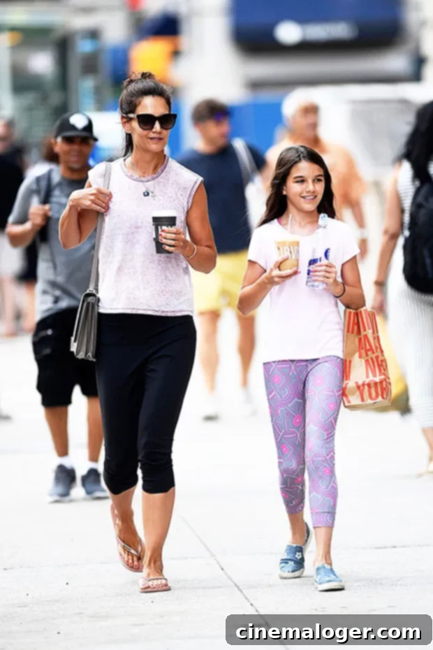 Katie Holmes and Suri: Finding Creativity in Quarantine 2 Katie Holmes and Suri Cruise enjoying iced coffee in New York City