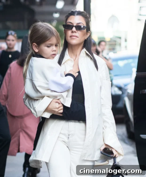 Kourtney Kardashians Emotional Goodbye to Reigns Long Hair 2 Kourtney Kardashian, Reign Disick looking grown up after his buzz cut, a significant milestone for the young son of Kourtney, symbolizing his independence.