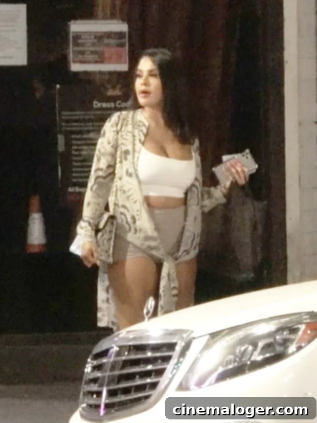 Rob Kardashian's Gorgeous Date Aileen Gisselle Makes First Public Appearance 3 Aileen Gisselle confidently walks the street in her casual attire, handbag, and phone, after her date with Rob Kardashian.