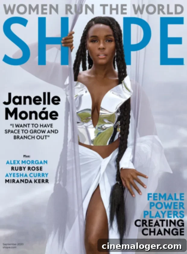 Janelle Monáe posing confidently in a vibrant red outfit on the cover of Shape Magazine's September 2020 issue.