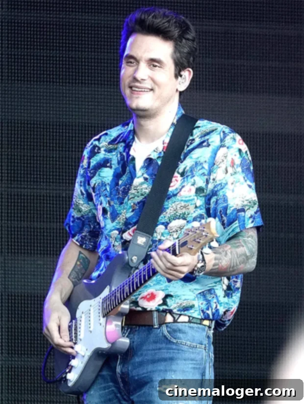 John Mayer's Longer Quarantine Hair Causes a Fan Frenzy Before and After Photos 2 John Mayer with long hair during quarantine, a significant change from his previous shorter hair seen while performing on Jimmy Kimmel Live.