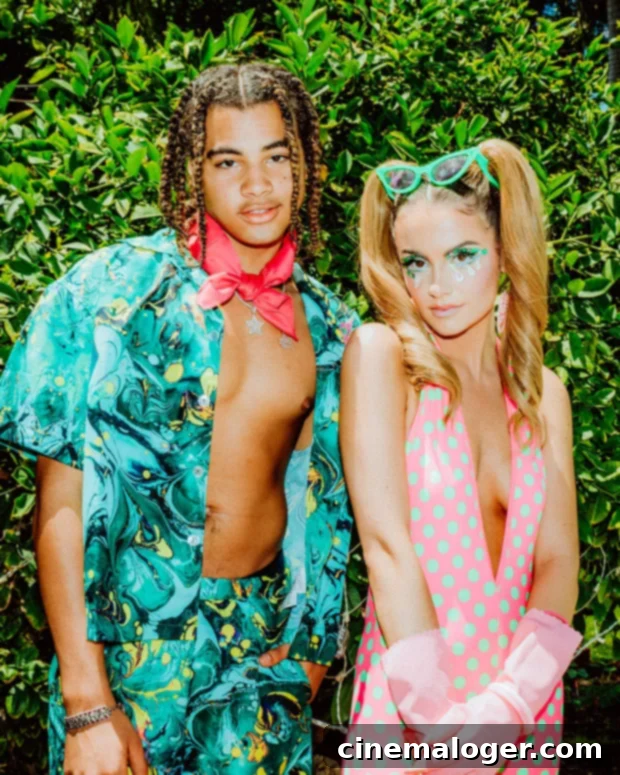 Chelsea Collins Dazzles & Gets Drenched on Set of 'Water Run Dry' Video 3 Chelsea Collins and 24kGoldn as Ken and Barbie
