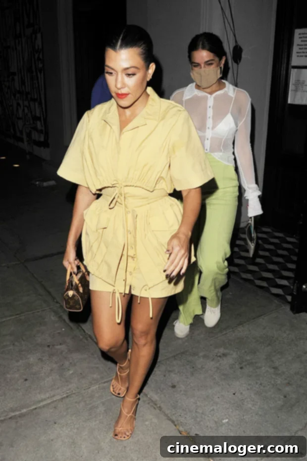 Isolation Chic: Kourtney, J.Lo & The Week's Top Celebrity Looks 2 Kourtney Kardashian in a yellow mini skirt and crop top