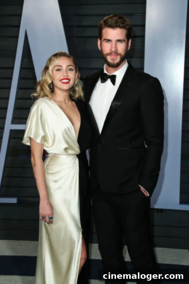 Miley Cyrus Shades Ex Liam Hemsworth On 'Win Some, Lose Some' Over 'Faking It' Lyric 3 Miley Cyrus, Liam Hemsworth smiling at an event