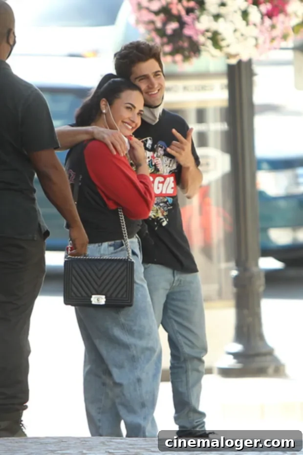 Demi Lovato's 'Still Have Me' Song Reveals Her Shattered Heart Post-Max Ehrich Breakup 2 Demi Lovato and Max Ehrich walking together on Rodeo Drive.