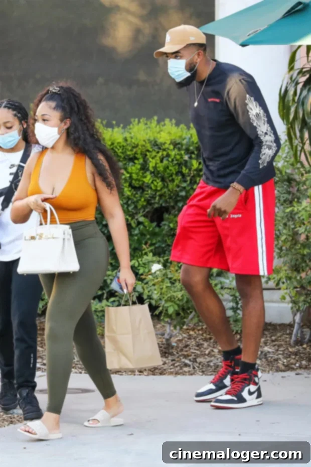 Karl-Anthony Towns' Intimate Lens on Jordyn Woods' Shower Pose 2 Jordyn Woods and Karl-Anthony Towns looking happy together on vacation