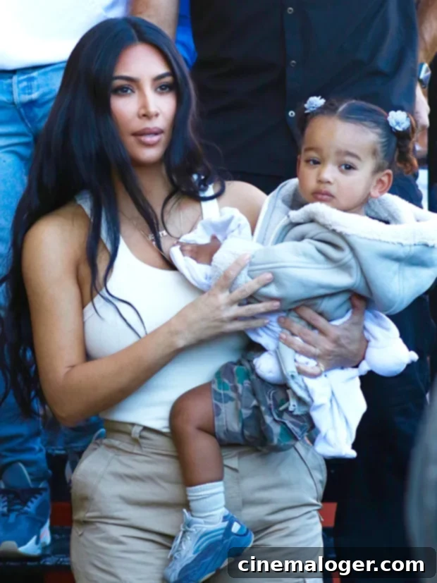Chicago West's Adorable Birthday Serenade for Kim Kardashian's 40th 2 Chicago West, Kim Kardashian's daughter, smiling playfully.