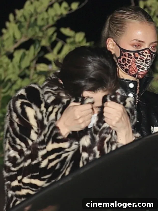 Rare Sighting Selena Gomez Dines With Friends At Nobu 3 Selena Gomez exits Nobu shielding her face