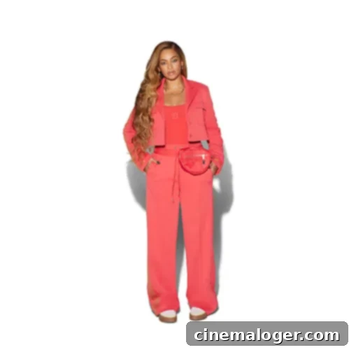 IVY PARK x adidas Drip 2 Cropped Suit Jacket in vibrant coral pink, with distinctive 3-Stripes tape on one arm and IVY PARK logos on the other.
