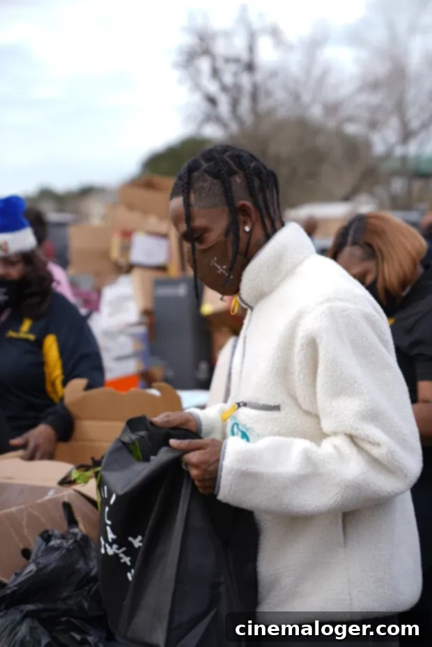 Tiny Helper Stormi, 2, Masks Up For Dad Travis Scott's Houston Toy Drive 3 Travis Scott