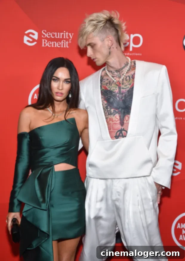 Megan Fox and Machine Gun Kelly's Scorching NYE Tongue Kiss 2 Megan Fox & Machine Gun Kelly arrive at the 2020 American Music Awards on November 22. It marked their first official red carpet appearance as a couple.