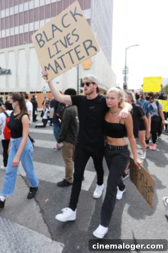 Three Months After Dramatic Split, Logan Paul and Josie Canseco Reunite at Mike Majlak's Birthday 2 Logan Paul and Josie Canseco marching with a Black Lives Matter sign in Los Angeles in June 2020.