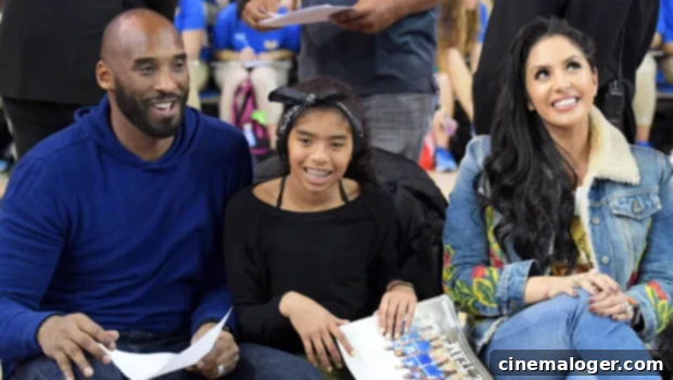 Vanessa Bryant Calls Kobe & Gianna Loss A 'Cluster Of Emotions' 3 Kobe, Gianna, and Vanessa Bryant smile together at a basketball game, showcasing their loving family bond.