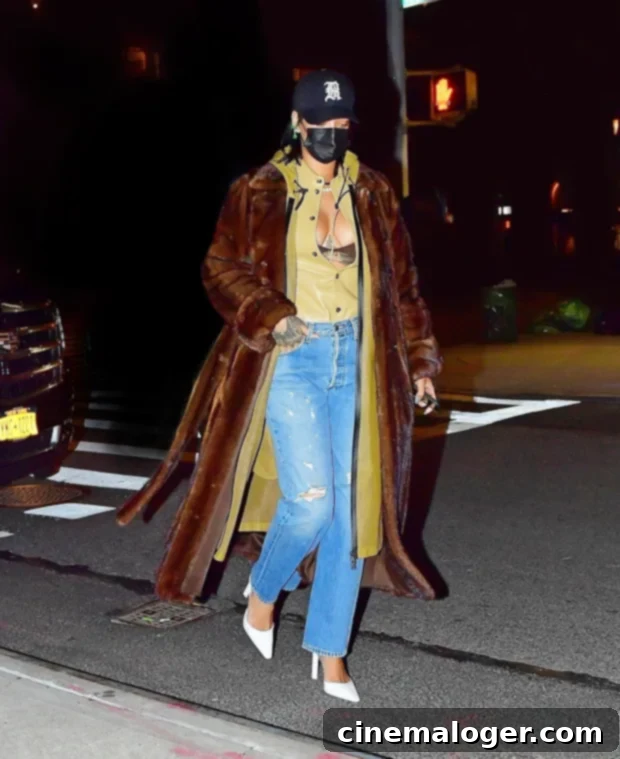 Rihanna Wows NYC: Jeans, Open Blouse, and a Lingerie Flash 2 Rihanna stepping out for dinner in NYC, showcasing her outfit