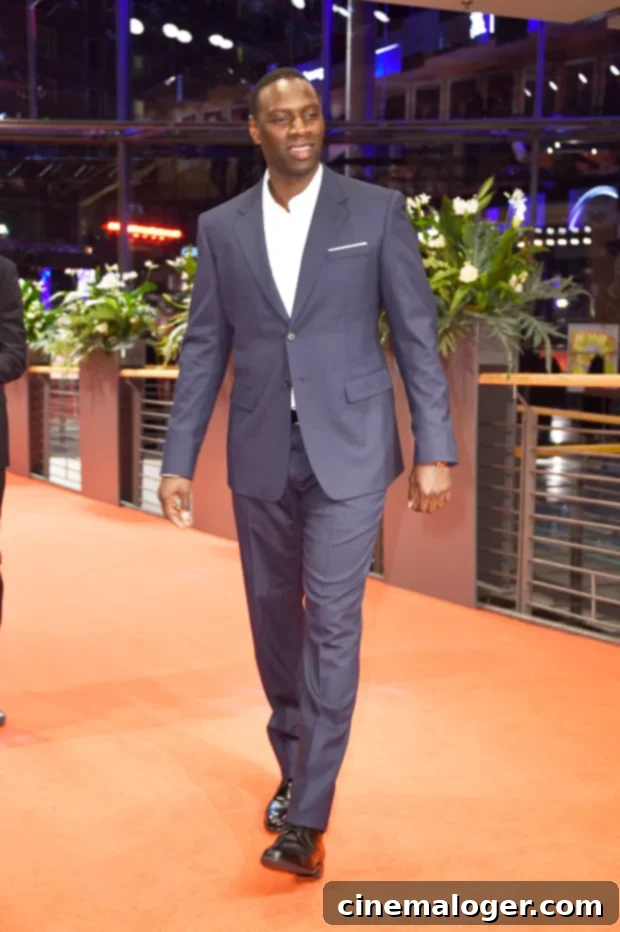 Omar Sy: 5 Reasons Why The Lupin Star Is Taking Over Netflix 3 Omar Sy at the premiere of ‘Police’ at the 2020 Berlin International Film Festival, showcasing his public presence.